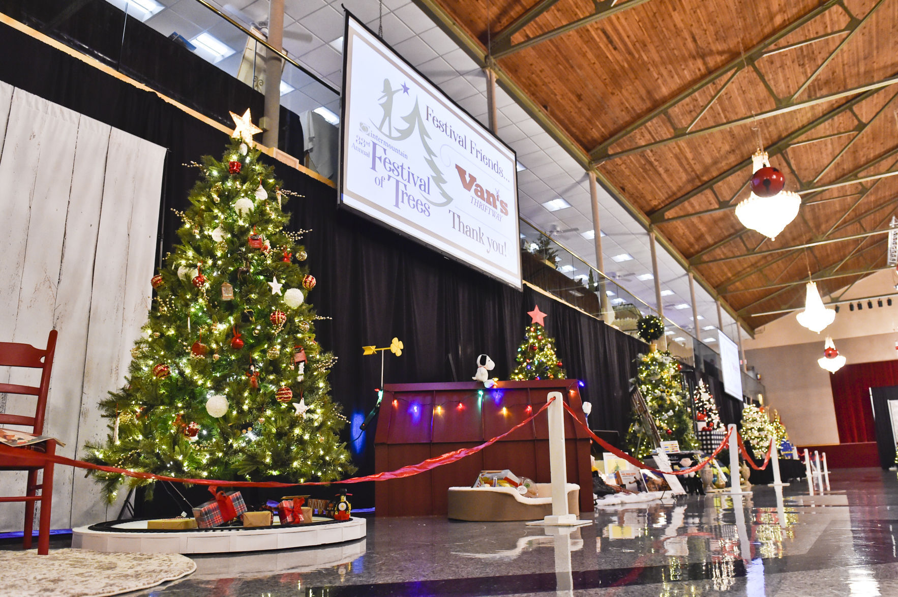 The Civic Center ballroom is decked with decorated Christmas trees